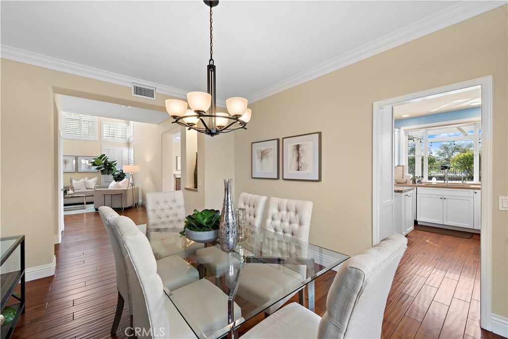 5 High Bluff Laguna Niguel, CA 92677 - Photo 14 of 64 a view of a dining room with furniture wooden floor and chandelier
