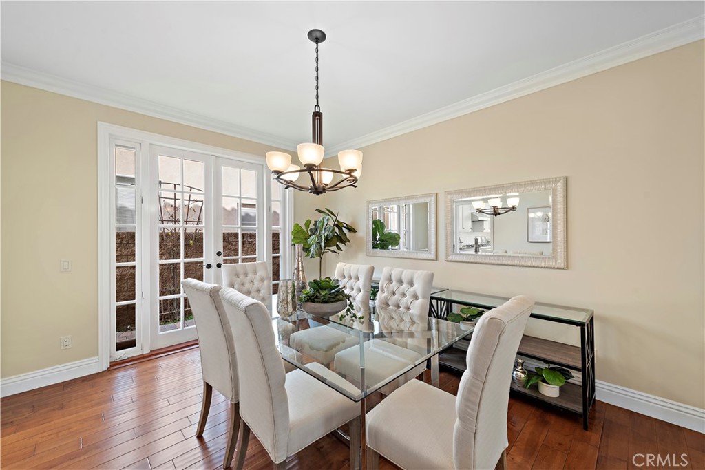 5 High Bluff Laguna Niguel, CA 92677 - Photo 16 of 64 a view of a dining room with furniture wooden floor and chandelier