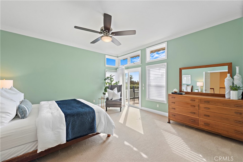 5 High Bluff Laguna Niguel, CA 92677 - Photo 20 of 64 a bedroom with a large bed and a chandelier