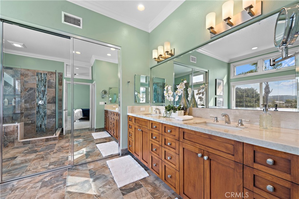 5 High Bluff Laguna Niguel, CA 92677 - Photo 21 of 64 a spacious bathroom with a shower sink and mirror