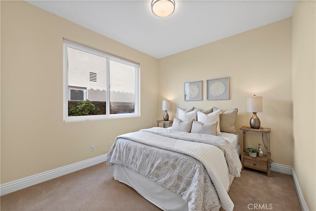 5 High Bluff Laguna Niguel, CA 92677 - Photo 37 of 64 a bedroom with a bed and a window