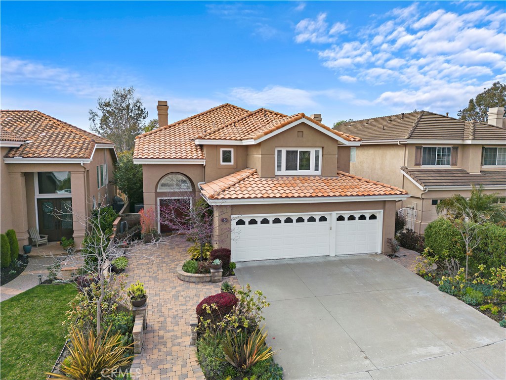 5 High Bluff Laguna Niguel, CA 92677 - Photo 48 of 64 a house with a flower garden in front of it