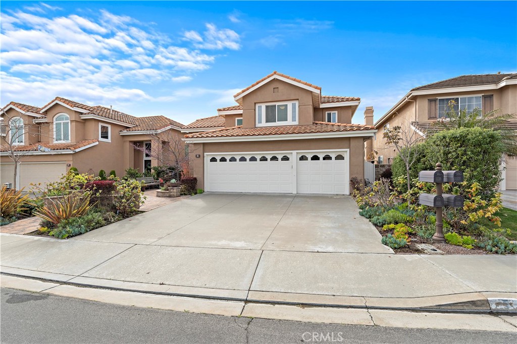 5 High Bluff Laguna Niguel, CA 92677 - Photo 51 of 64 a front view of a house with a garden