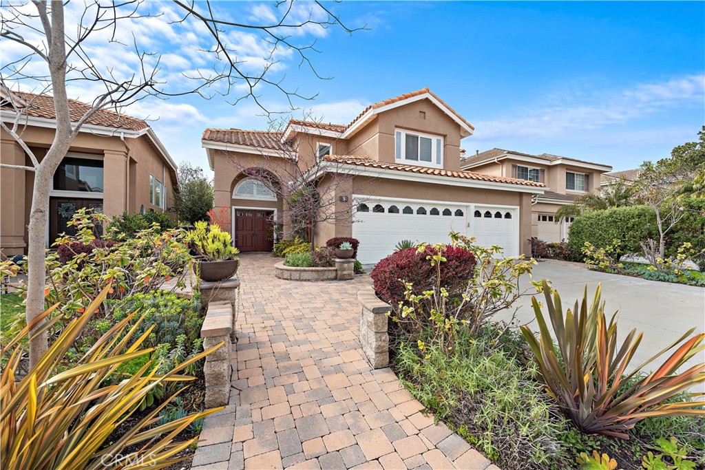 5 High Bluff Laguna Niguel, CA 92677 - Photo 57 of 64 a front view of a house with garden