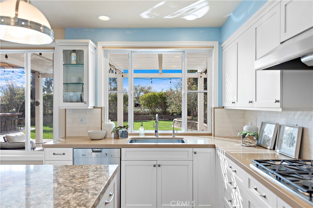 5 High Bluff Laguna Niguel, CA 92677 - Photo 8 of 64 a kitchen with stainless steel appliances granite countertop a stove and a sink