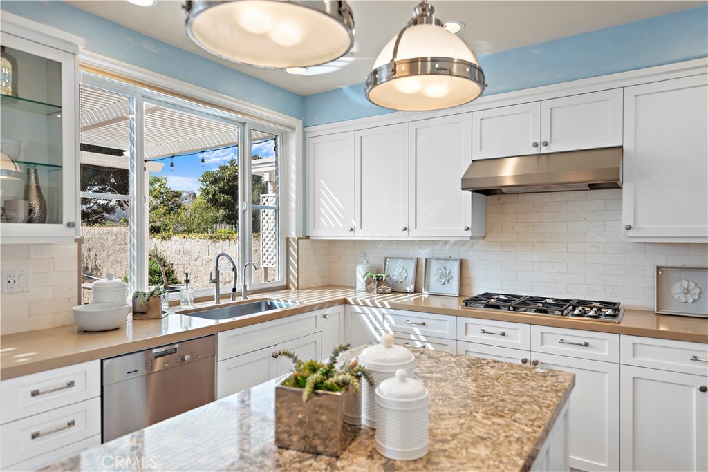 5 High Bluff Laguna Niguel, CA 92677 - Photo 9 of 64 a kitchen with stainless steel appliances granite countertop a stove a sink and a white cabinets