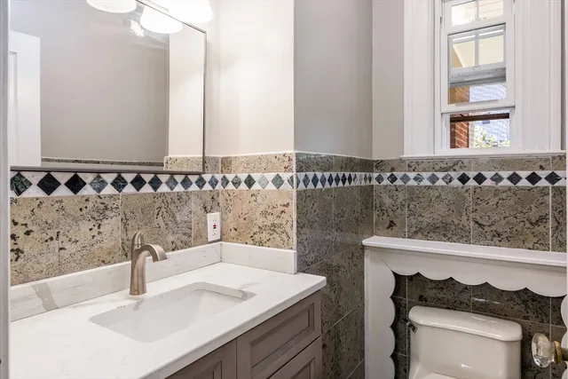 a kitchen with a refrigerator and a sink