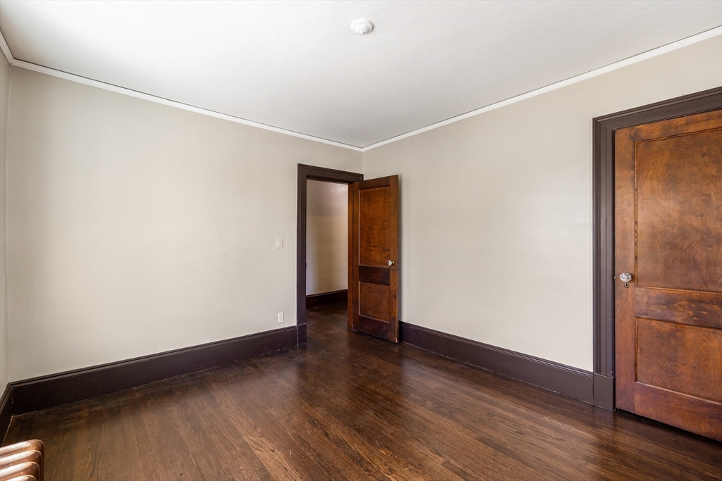 122 Bellevue Avenue Springfield, MA 01108 - Photo 26 of 32 a view of an empty room with wooden floor