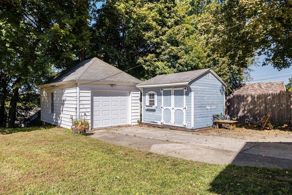 122 Bellevue Avenue Springfield, MA 01108 - Photo 29 of 32 a view of a house with a yard and garage