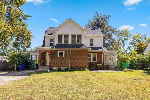 a front view of a house with a yard