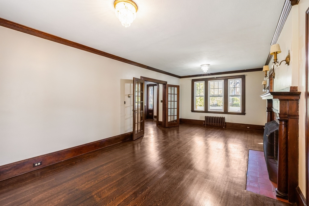 122 Bellevue Avenue Springfield, MA 01108 - Photo 6 of 32 a view of livingroom with hardwood and window