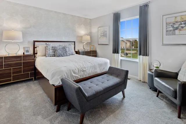 a bedroom with a bed and a couch