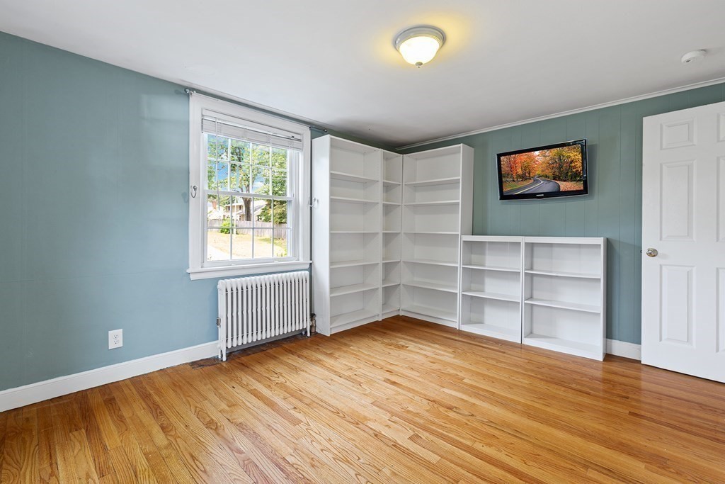 34 Londonderry Road Framingham, MA 01701 - Photo 12 of 33 an empty room with wooden floor and windows