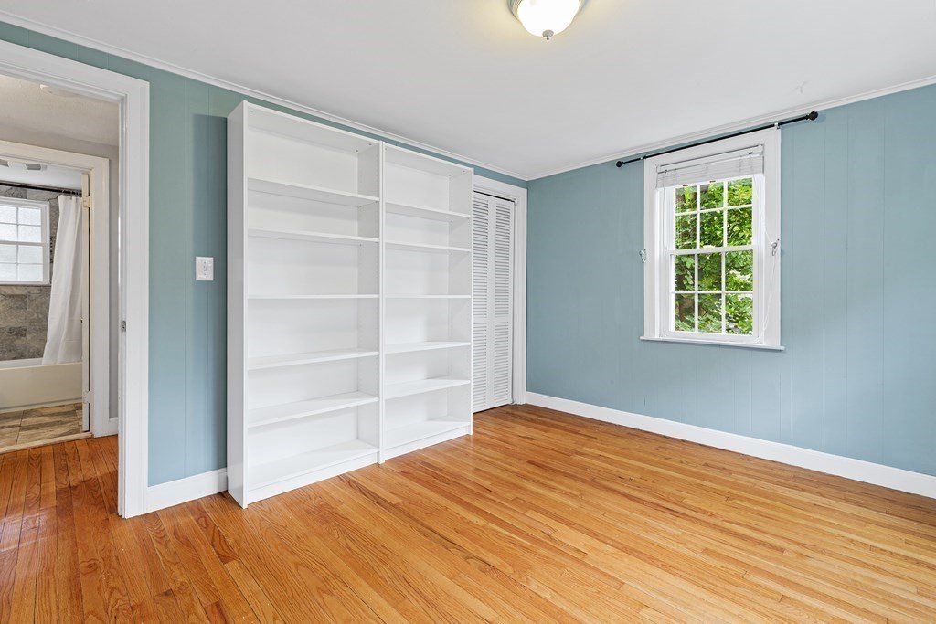 34 Londonderry Road Framingham, MA 01701 - Photo 13 of 33 a view of an empty room with wooden floor and a window