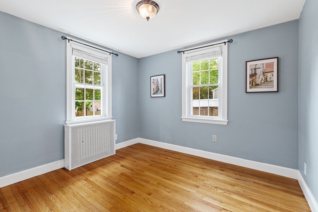34 Londonderry Road Framingham, MA 01701 - Photo 15 of 33 a view of an empty room with wooden floor and a window