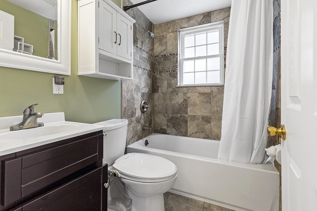 34 Londonderry Road Framingham, MA 01701 - Photo 16 of 33 a bathroom with a sink a toilet and a bathtub
