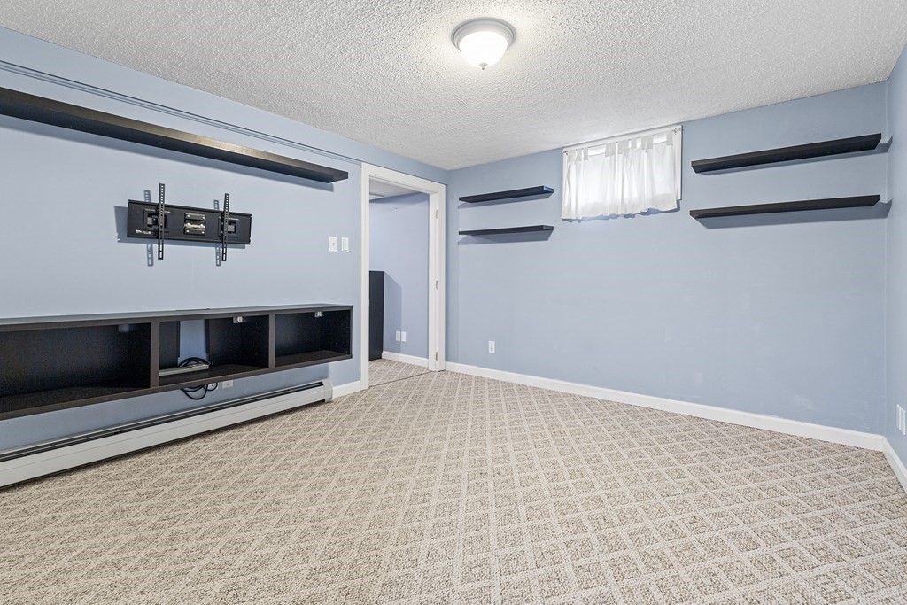 34 Londonderry Road Framingham, MA 01701 - Photo 24 of 33 an empty room with windows and fireplace