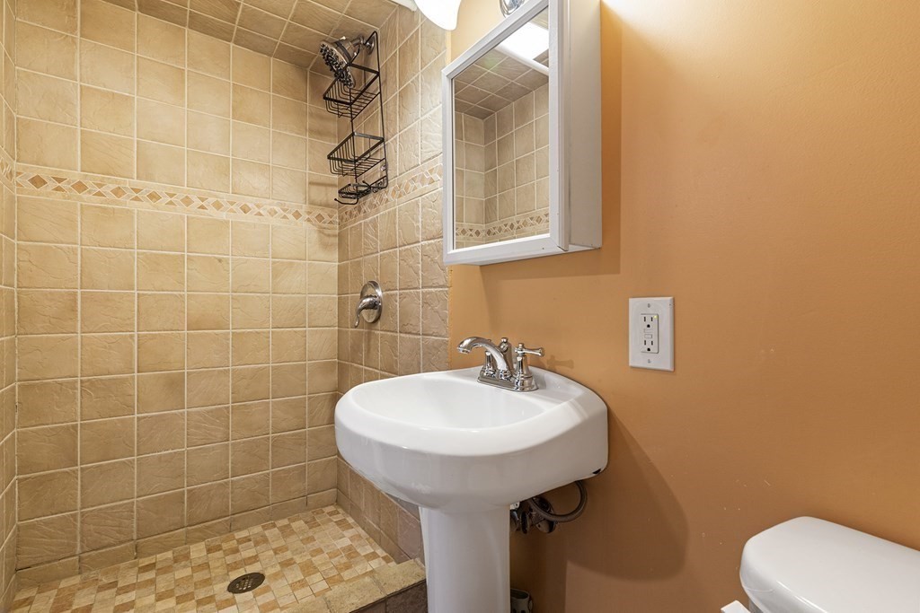 34 Londonderry Road Framingham, MA 01701 - Photo 26 of 33 a bathroom with a sink toilet and shower