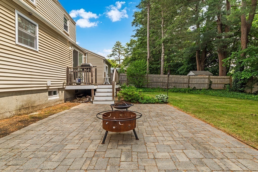 34 Londonderry Road Framingham, MA 01701 - Photo 29 of 33 a view of a patio with table and chairs with wooden fence and plants
