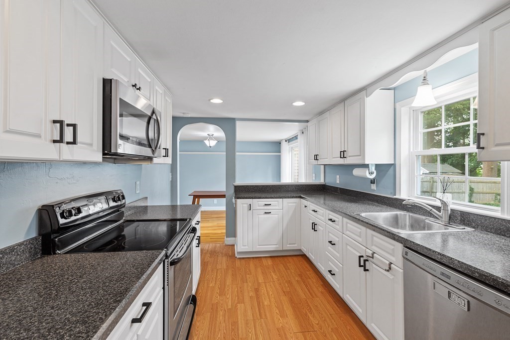 34 Londonderry Road Framingham, MA 01701 - Photo 7 of 33 a kitchen with granite countertop a sink a counter space appliances and cabinets