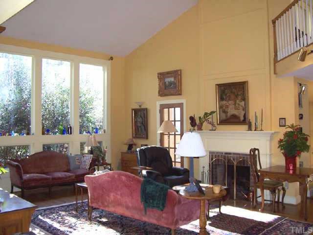 6323 Mt Mitchell Road Efland, NC 27243 - Photo 3 of 10 Soaring living room with masonary fireplace.