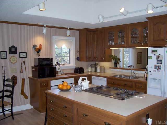 6323 Mt Mitchell Road Efland, NC 27243 - Photo 5 of 10 Cook kitchen with gas cooktop.