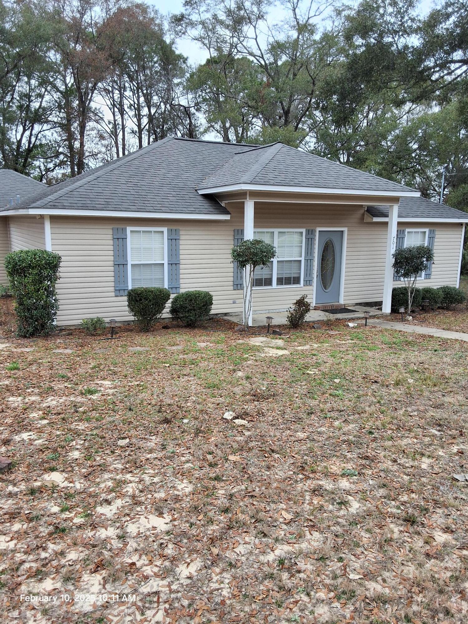 a house that has a tree in front of it