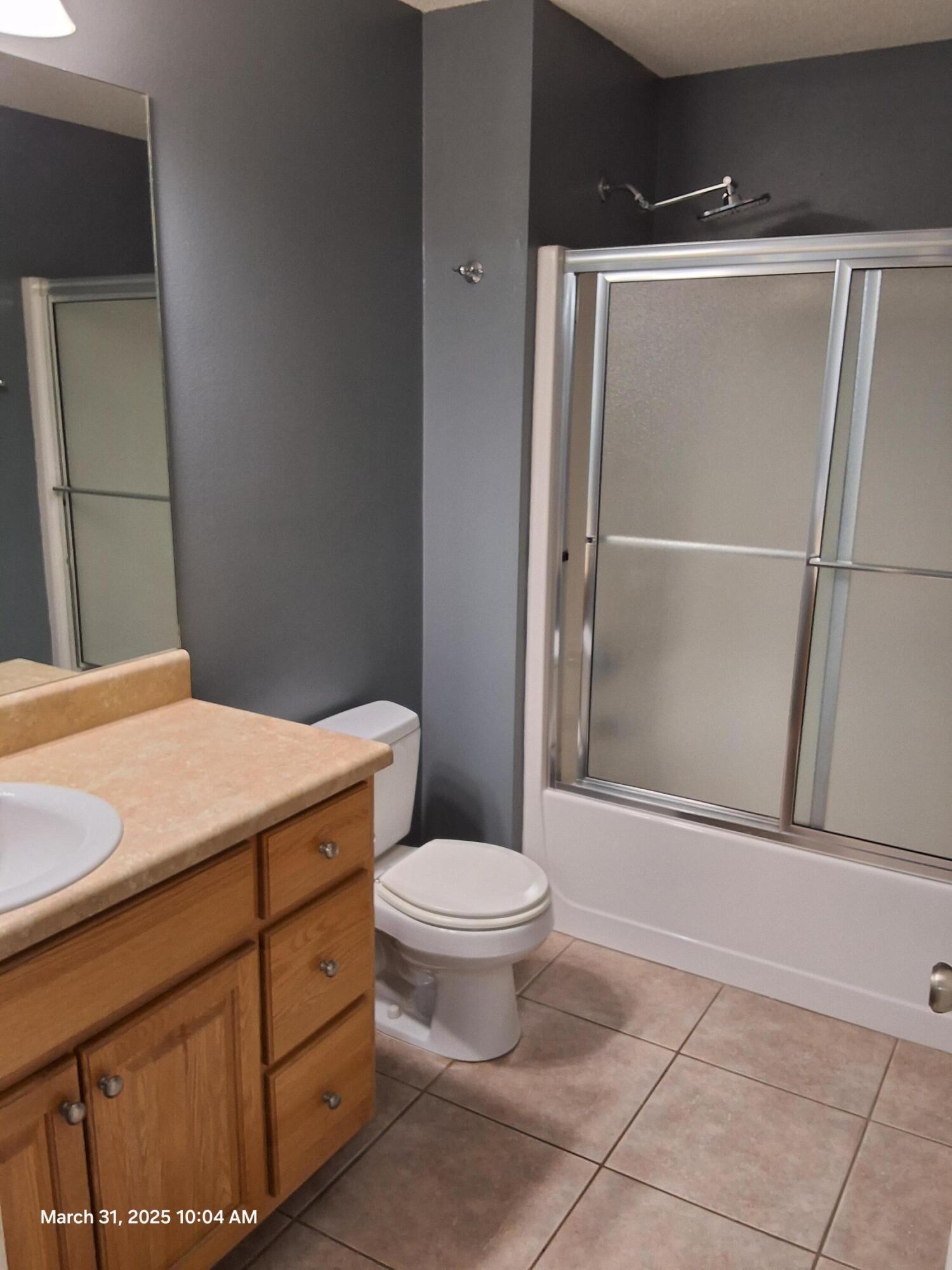 701 Georgia Street Crestview, FL 32536 - Photo 17 of 26 a bathroom with a toilet and a shower