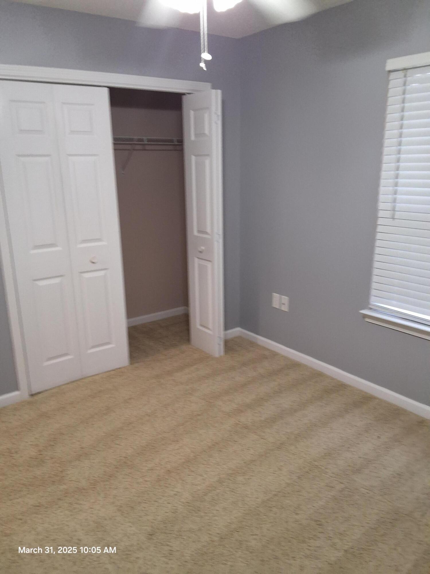 701 Georgia Street Crestview, FL 32536 - Photo 21 of 26 an empty room with windows and closet