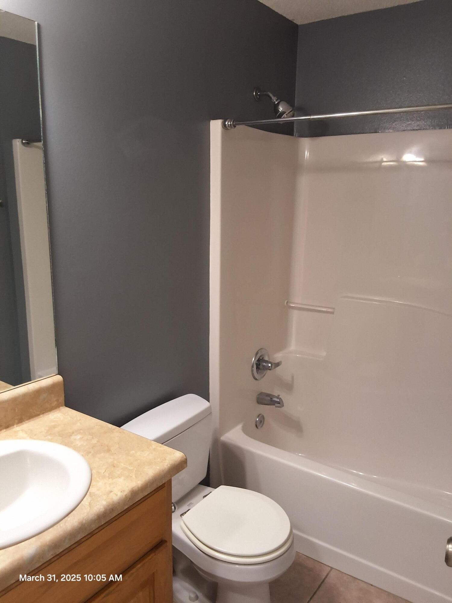 701 Georgia Street Crestview, FL 32536 - Photo 23 of 26 a white toilet sitting next to a bath tub
