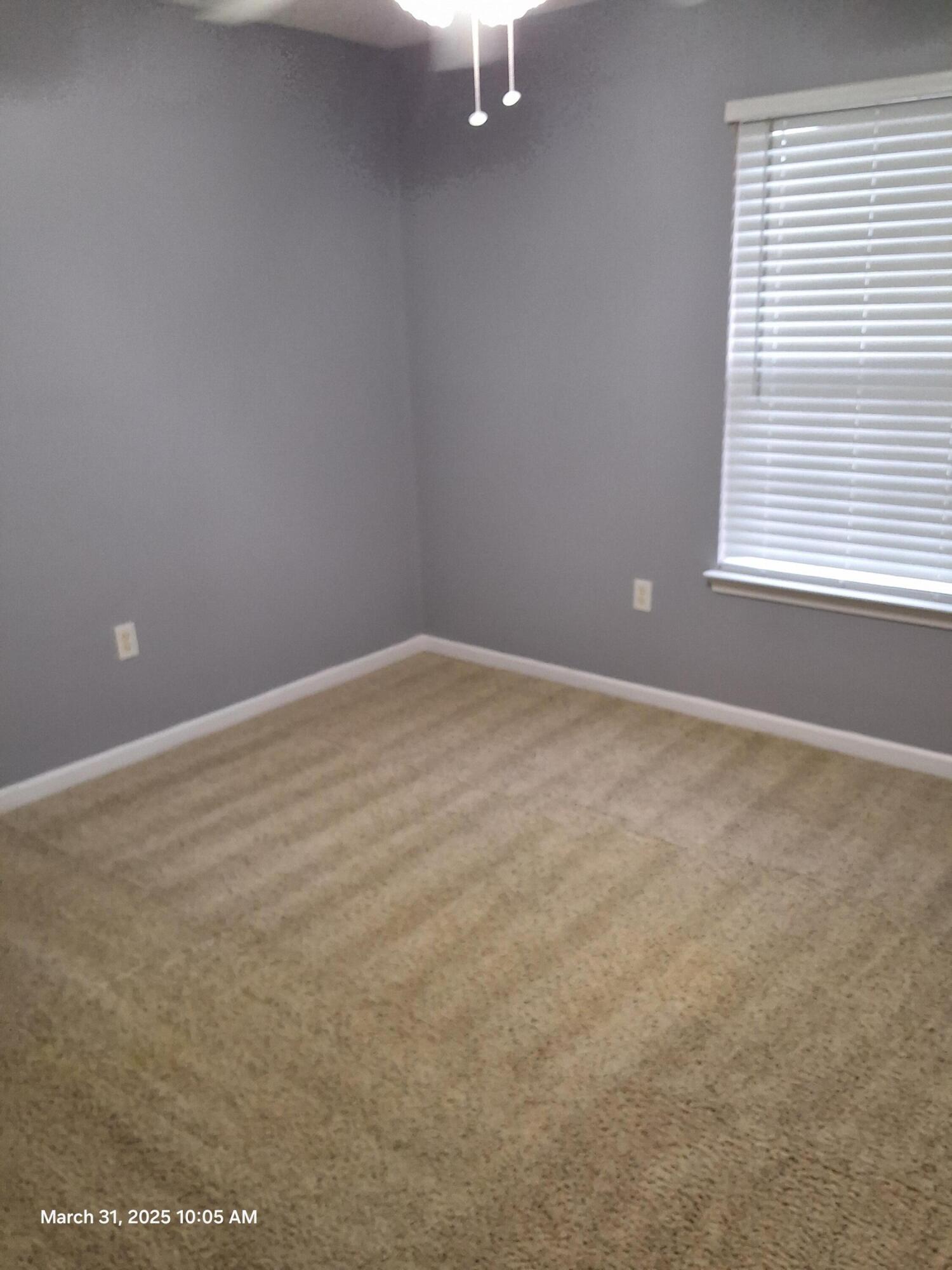 701 Georgia Street Crestview, FL 32536 - Photo 24 of 26 an empty room with a window