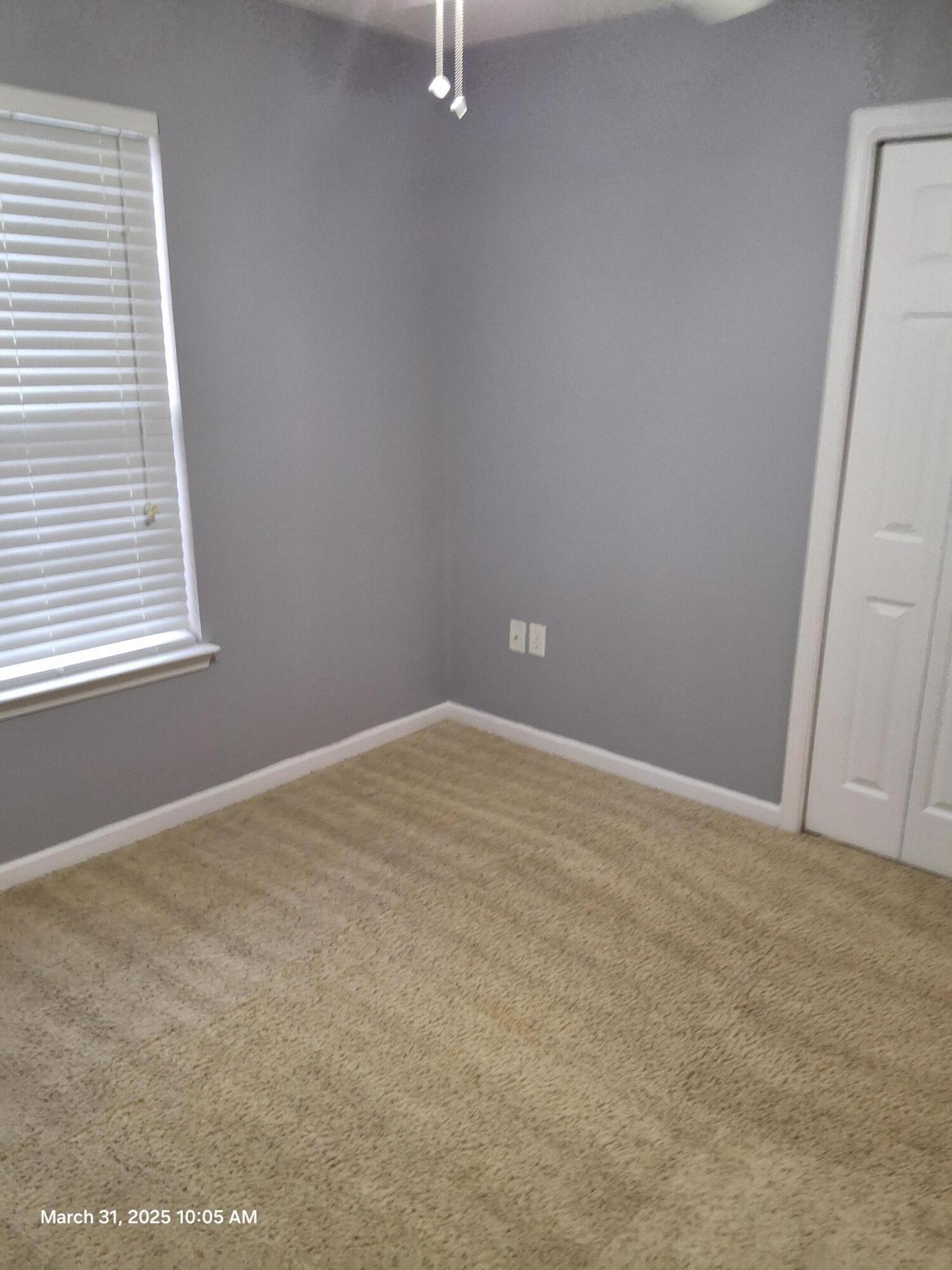 701 Georgia Street Crestview, FL 32536 - Photo 25 of 26 an empty room with windows