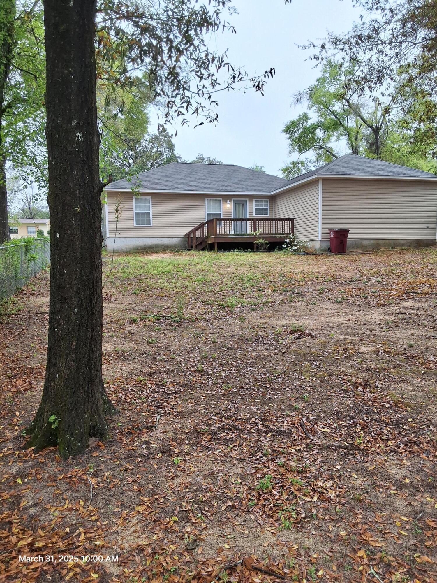 701 Georgia Street Crestview, FL 32536 - Photo 6 of 26 a front view of a house with a garden