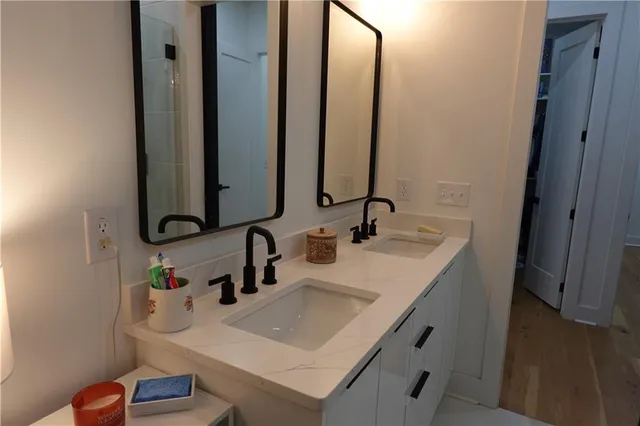 a bathroom with a sink and a mirror