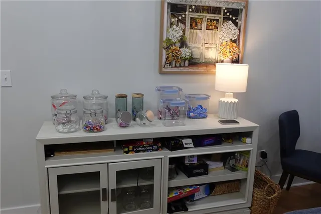 a view of a workspace with furniture and wooden floor