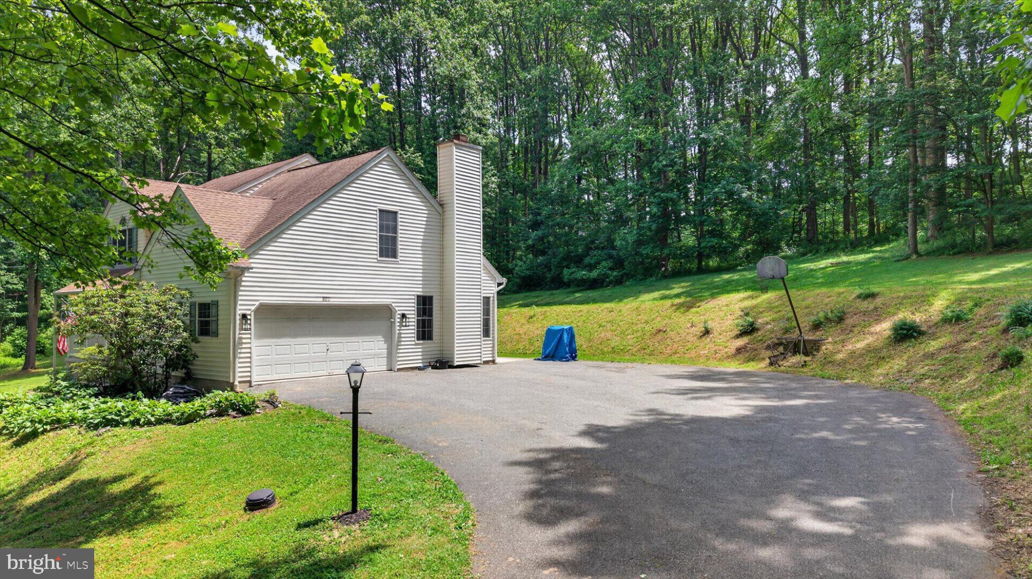 802 Hollow Road Delta, PA 17314 - Photo 4 of 45 Charming home nestled in lush greenery.