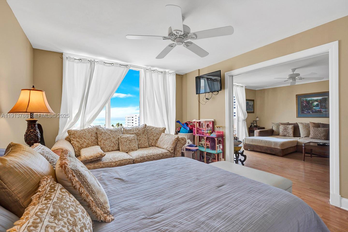 1500 South Ocean Drive, Unit 9J Hollywood, FL 33019 - Photo 14 of 32 a bedroom with furniture and a large window