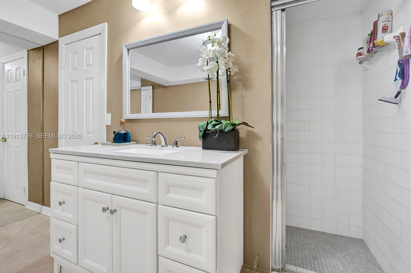 1500 South Ocean Drive, Unit 9J Hollywood, FL 33019 - Photo 15 of 32 a bathroom with a sink and a mirror