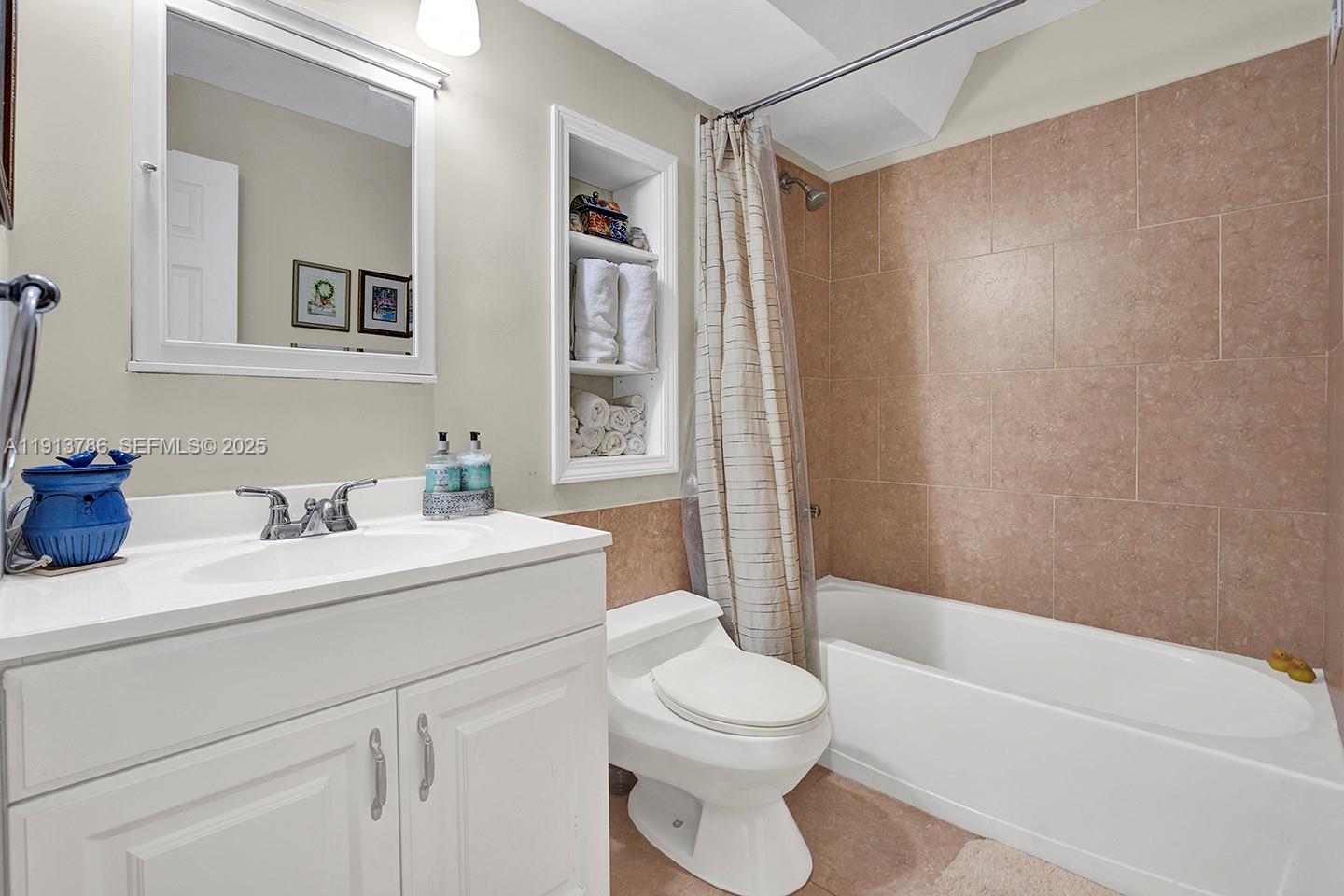 1500 South Ocean Drive, Unit 9J Hollywood, FL 33019 - Photo 16 of 32 a bathroom with a sink a toilet and shower