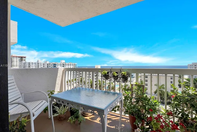 a view of a balcony with chairs