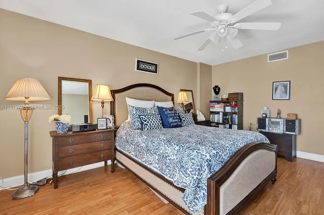 a bedroom with bed and a dresser