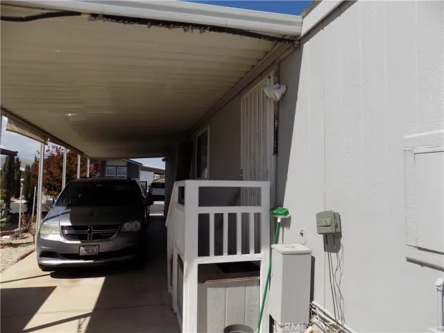 a bedroom with a bed and a television