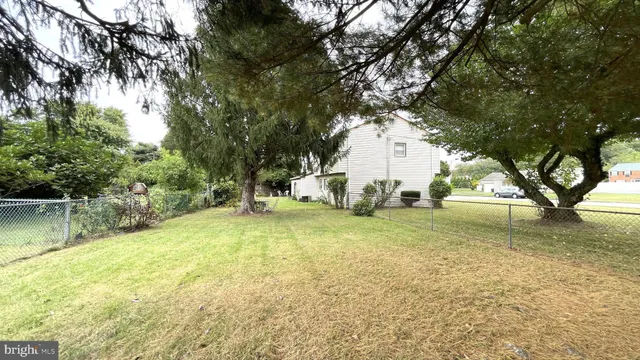 a view of yard with swimming pool
