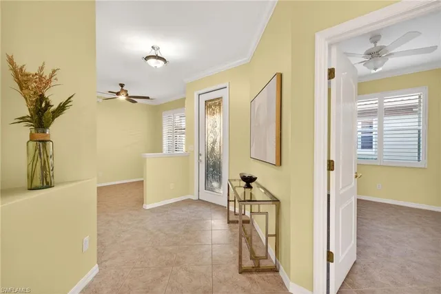 a view of an entryway with wooden floor and a livingroom