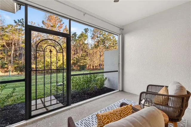 a living room with a couch and a large window