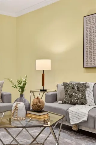a living room with furniture and a lamp
