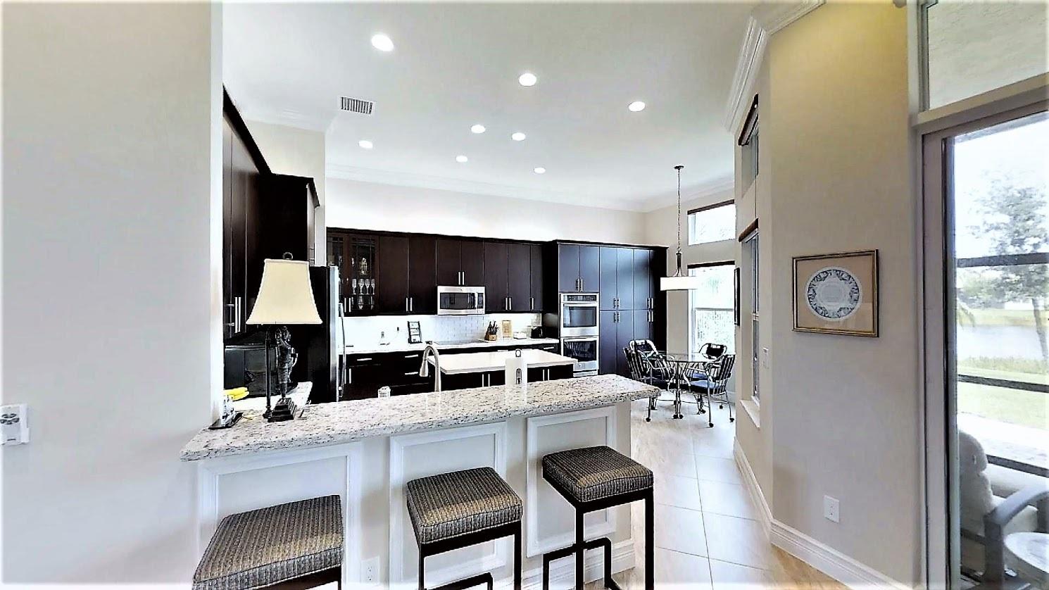 12055 Bear River Road Boynton Beach, FL 33473 - Photo 12 of 40 12055-Bear-River-Rd-kitchen from GR