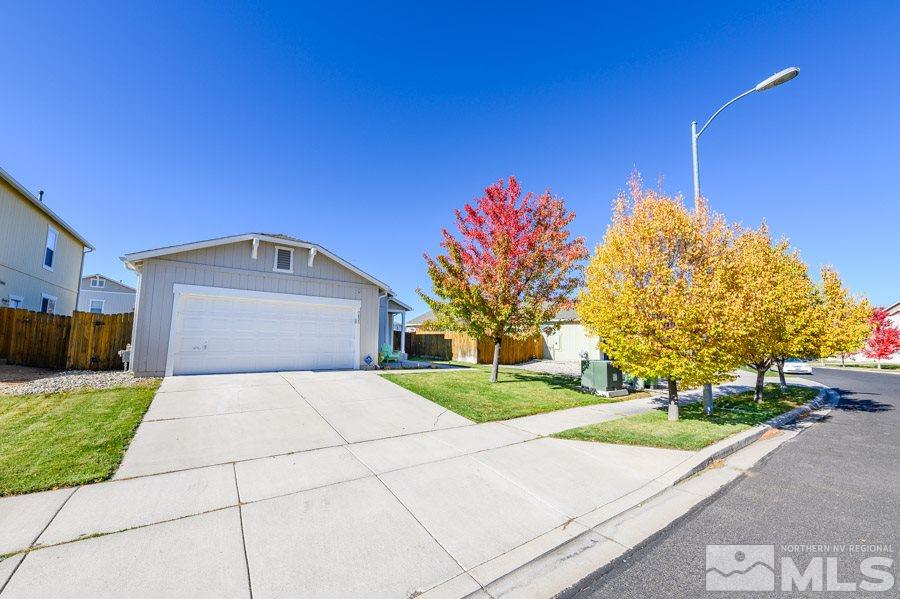 7635 Corso Street Reno, NV 89506 - Photo 1 of 19 a house with yard in front of it