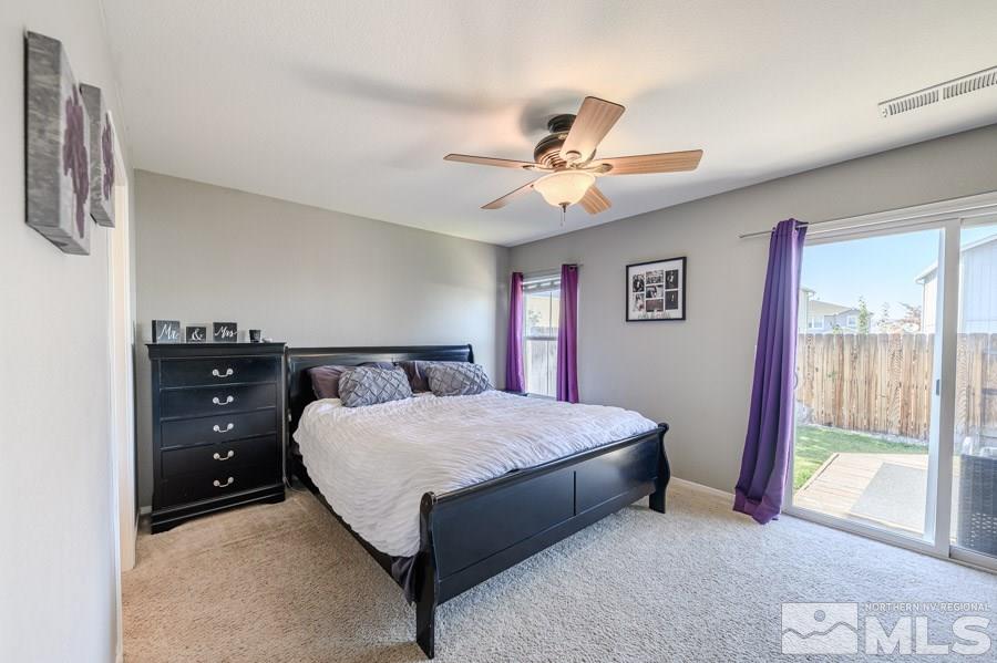 7635 Corso Street Reno, NV 89506 - Photo 11 of 19 a bed sitting in a bedroom next to a window