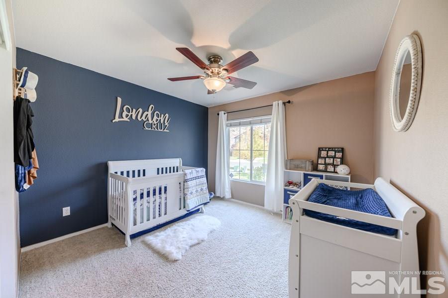 7635 Corso Street Reno, NV 89506 - Photo 13 of 19 a bedroom with furniture and a window